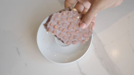 close up of a chocolate bar with hazelnuts