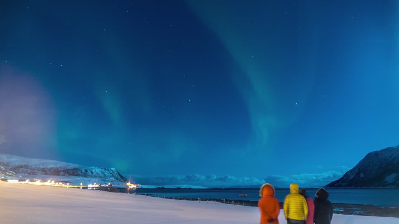 Guy proposing to his girlfriend with their friends while watching the Northern Lights in Lapland Southern Finland  Time lapse