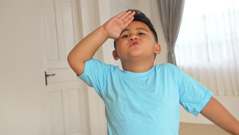 little boy making military salute, slow motion