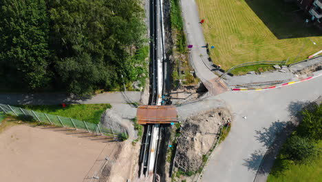 Aerial-Shot-Of-Heating-Pipeline,-Outdoor-Construction-Site