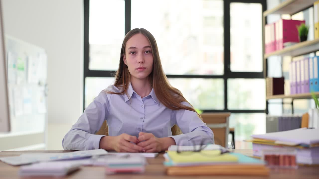 Woman meditating at her office desk