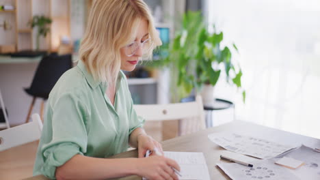 woman takes notes and plans calendar of meetings