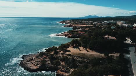 Crane-shot-from-the-shore-of-Ametlla-de-mar-in-Tarragona,-Catalonia,-Spain---aerial-view