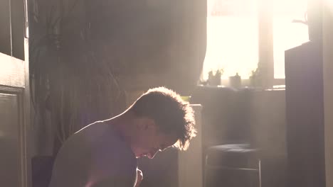 a man coughing in a dusty environment
