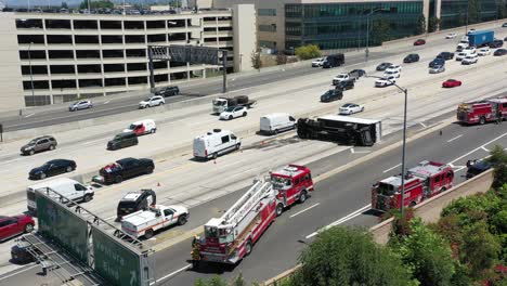 aerial view of a major highway accident involving an overturned semi-truck and emergency response