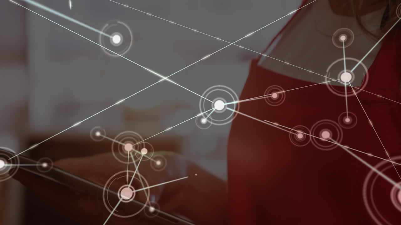 Animation of network of connections against caucasian waitress using tablet at a cafe