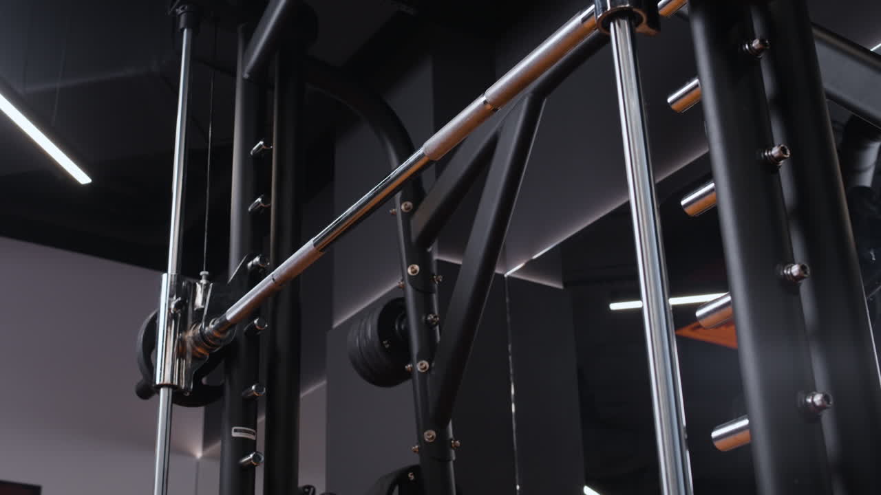 Woman Performing Back Exercises on a Cable Machine