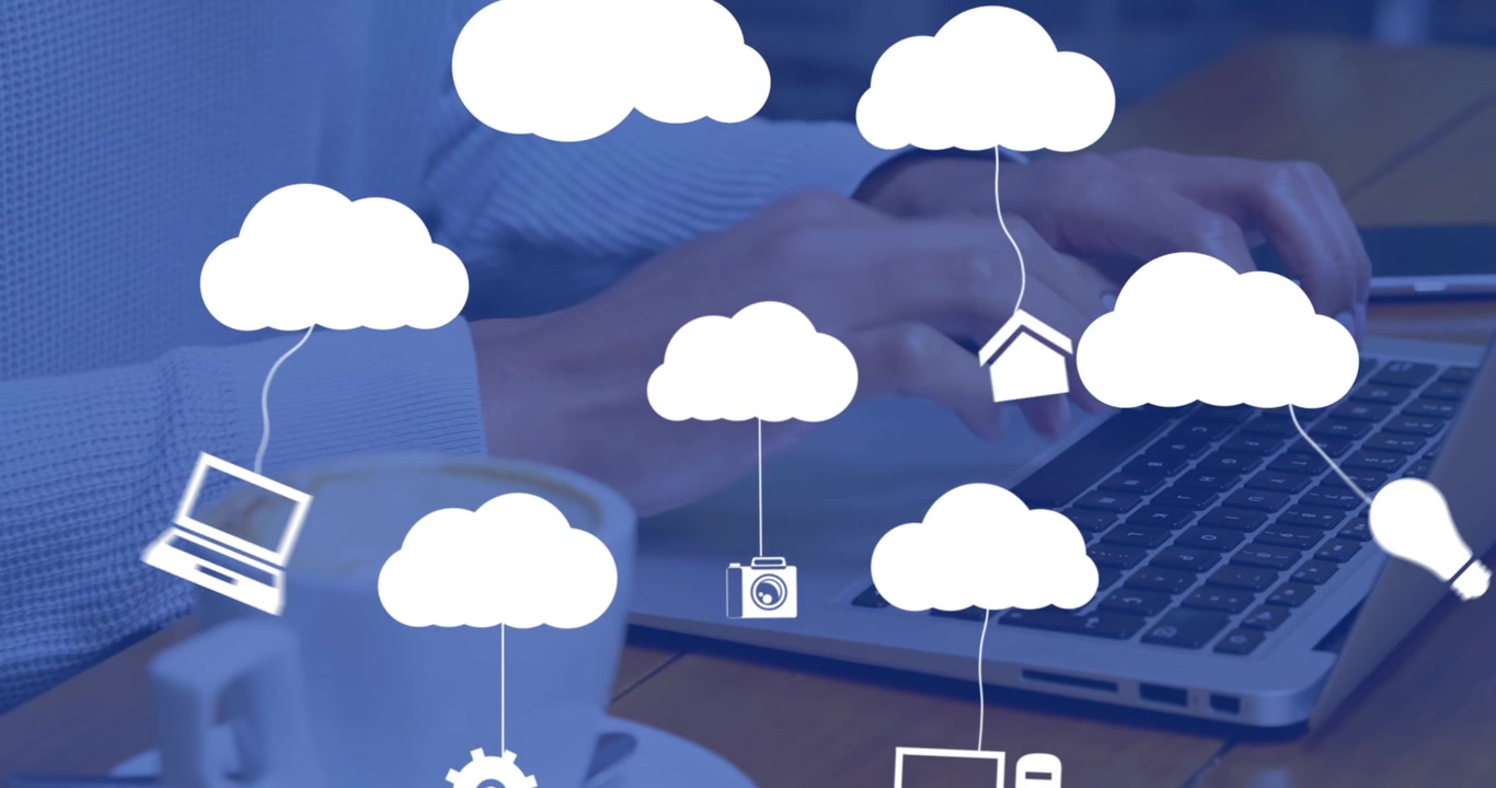 Animation of clouds with icons over hands using laptop