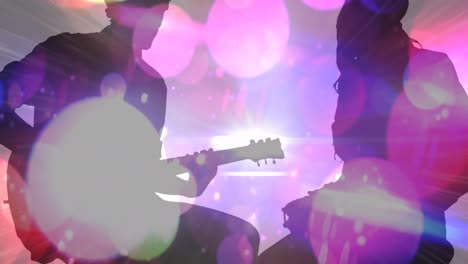 Animation-of-colourful-spots-moving-over-silhouette-of-man-and-women-playing-guitar-and-drums