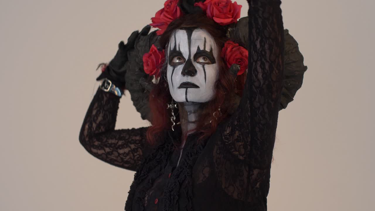 Woman in a Creepy Halloween Costume with Horns and Roses