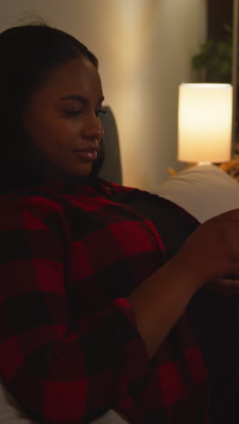 woman relaxing in bed at night