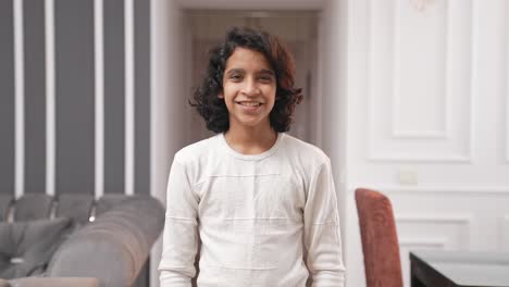 happy indian teenage kid smiling