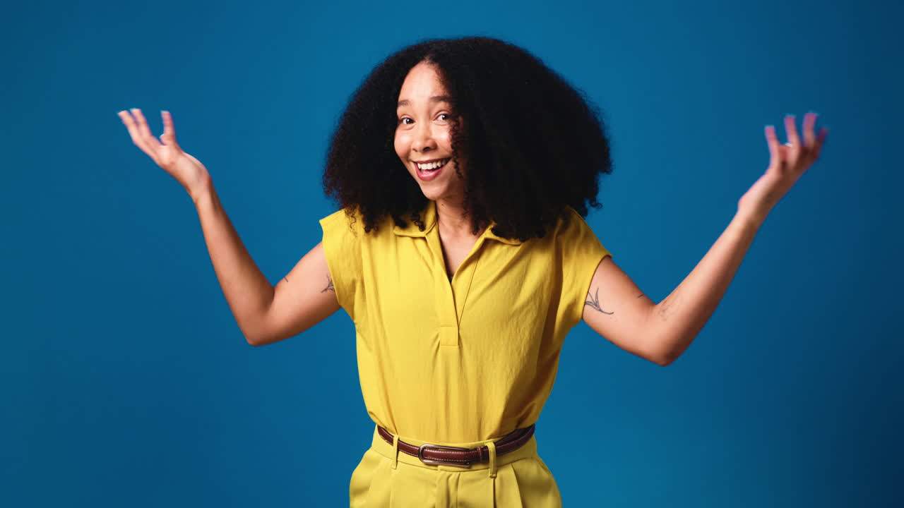 Woman with Curly Hair in Yellow Shirt