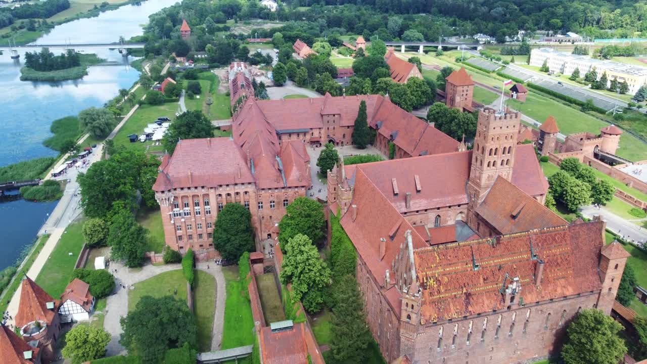 Vast Gothic layout of Malbork Castle and nearby Nogat River. Malbork, Poland