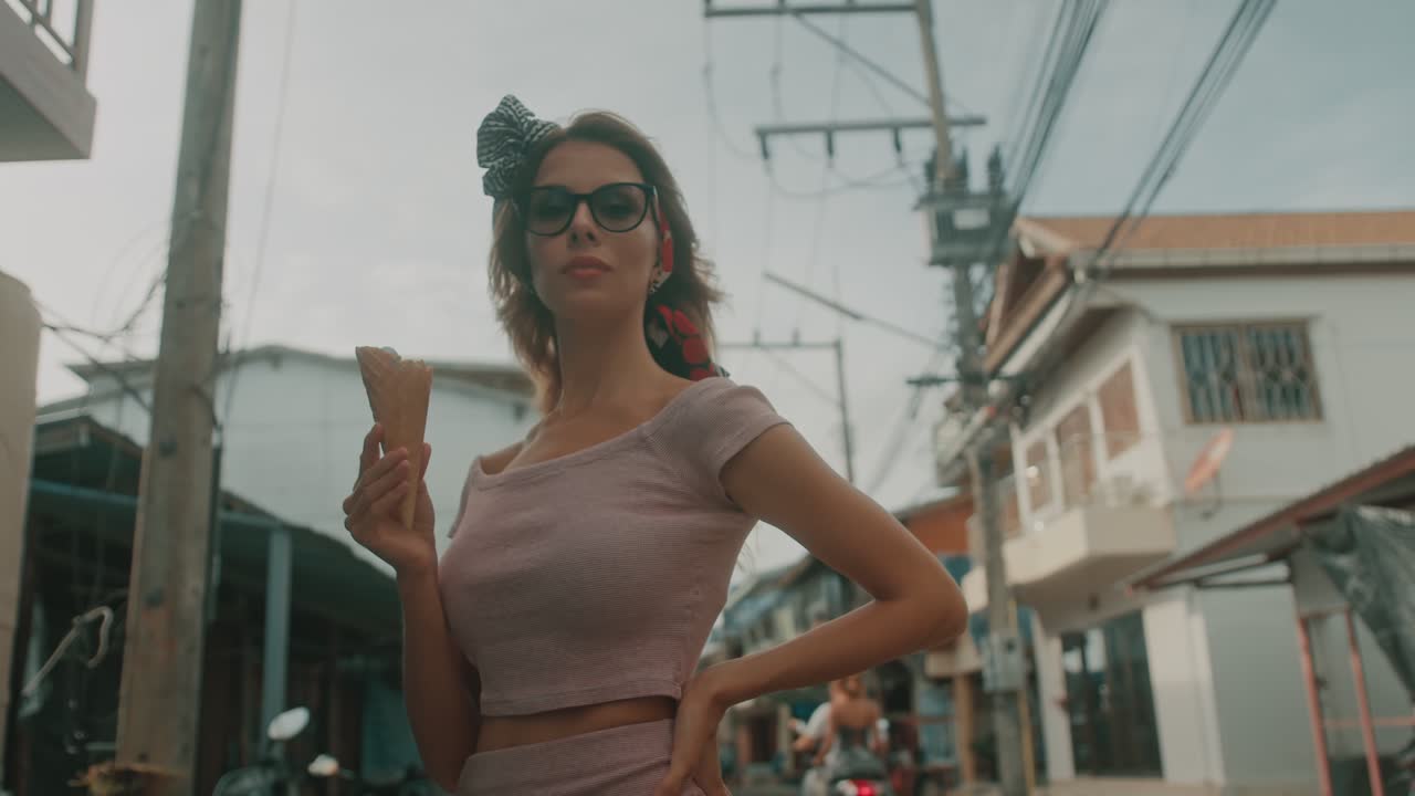 Stylish Woman Eating Ice Cream on a Street