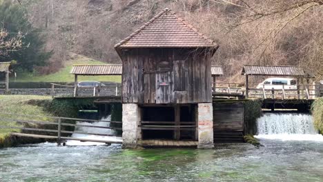 house with a mill on the river