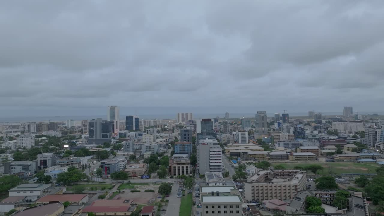 Aerial view of Victoria Island, Lagos, showcasing high-rise buildings, busy streets, and coastal beauty.