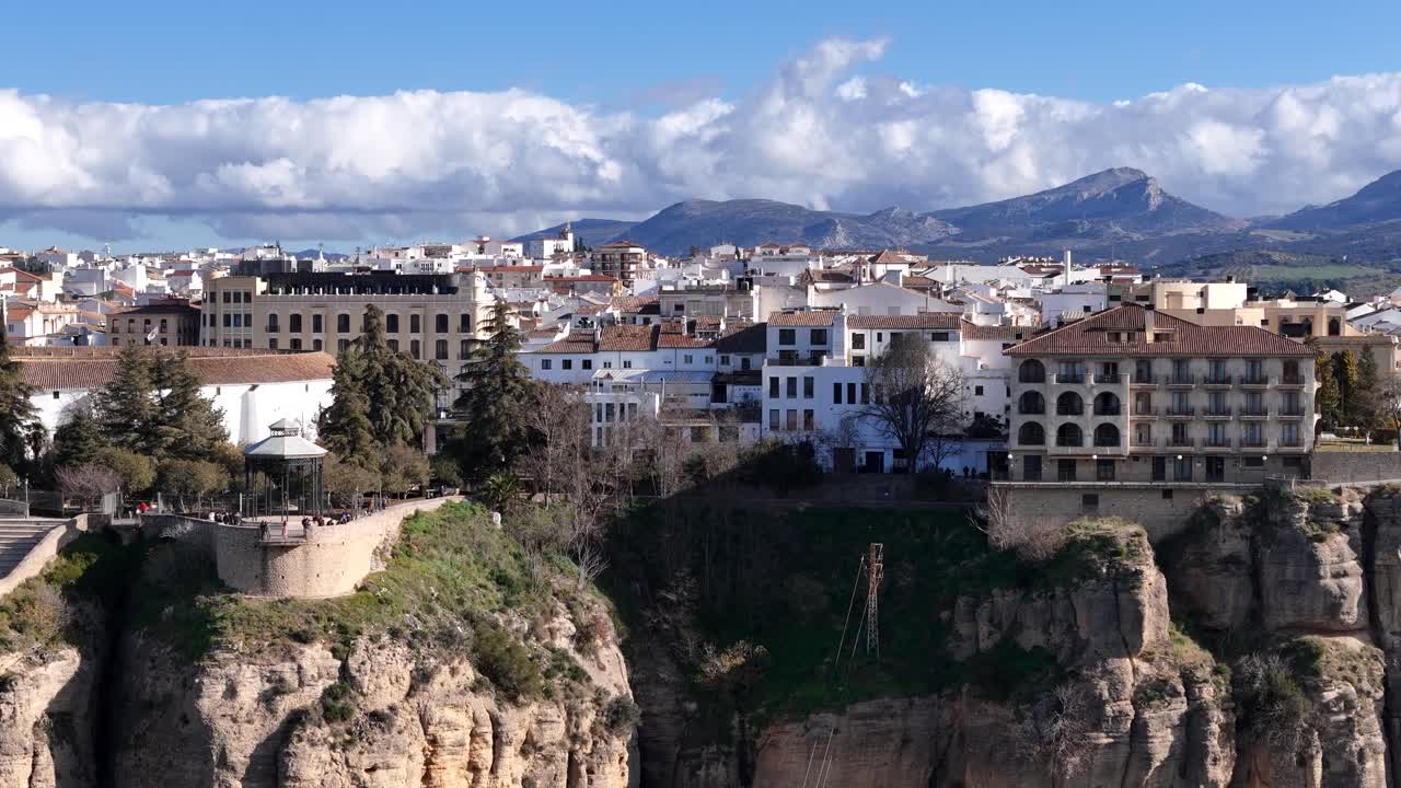 Ronda white village in Malaga built in a gorge. Aerial parallax