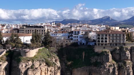 ronda white village in malaga built in a gorge. aerial parallax