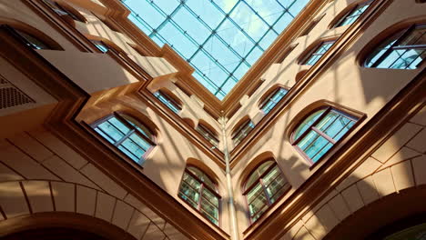 abstract architecture of atrium with arched windows and a glass ceiling