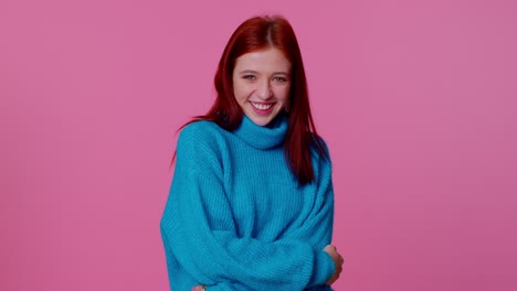 Cheerful-lovely-teenager-student-girl-fashion-model-in-blue-sweater-smiling-and-looking-at-camera