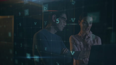 warning text and numerical data animation over two people working on computer