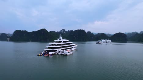 aerial of luxury mega yacht anchored in ha long bay vietnam at sunset