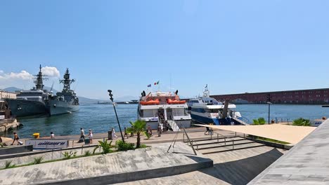 boats and people at naples harbor