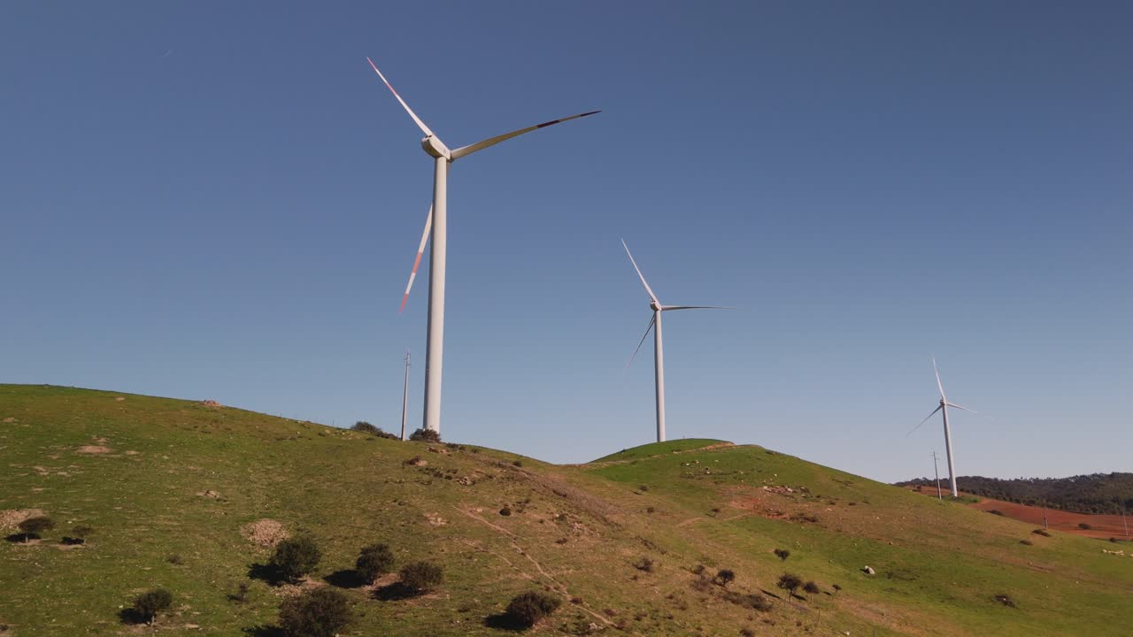 Wind Farm - Wind Turbines On Hills Against Blue Sky
