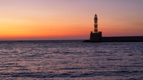 Silhouetted-Chania-Lighthouse-Against-Beautiful-Sunset-Sky-In-Crete,-Greece