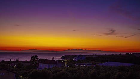 Timelapse-shot-of-colorful-sky-after-sunset-along-the-shore-of-Greece-during-evening-time