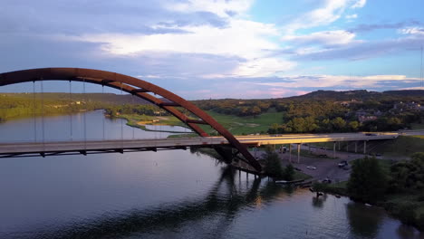 flying over pennybacker bridge to reveal austin skyline