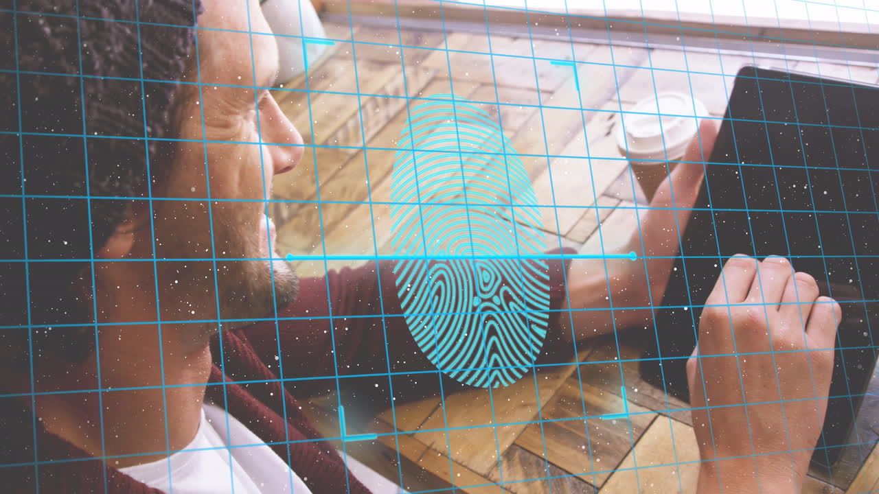 Animation of fingerprint and padlock in shields over caucasian man scrolling on digital tablet