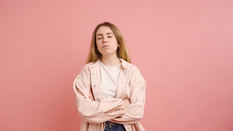 young woman expressing different emotions on pink background