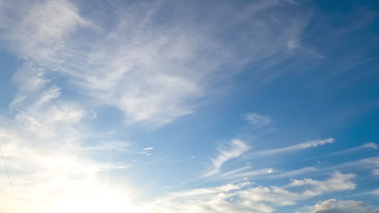 Light weightless spindrift clouds flying in the skies. Summer season azure skies from low angle view. Timelapse.