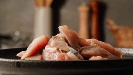 sliced raw fish on a plate