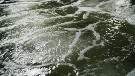 aeration of shrimp pool water. air bubbles rising up. shrimp farm. shooting close-up