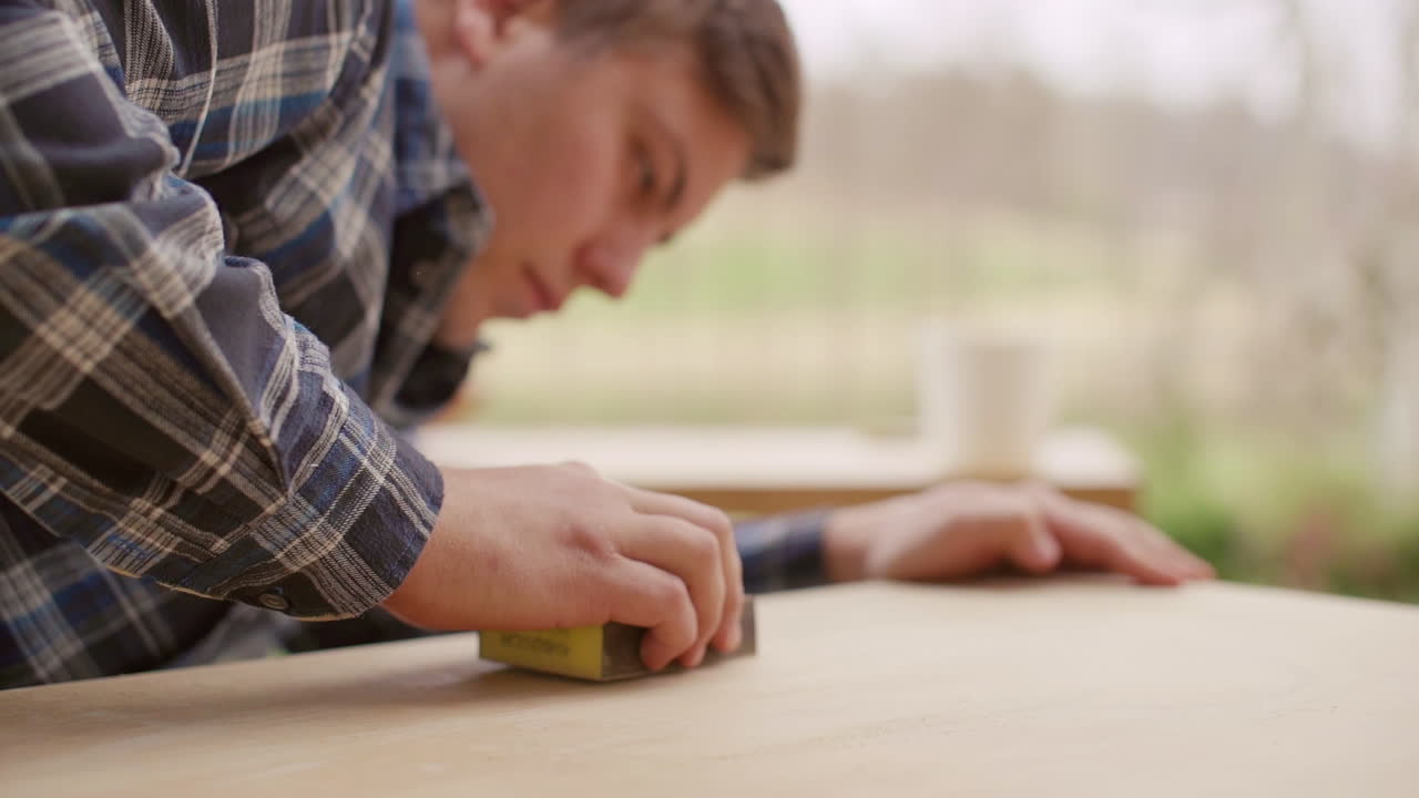 Man Sanding Wood