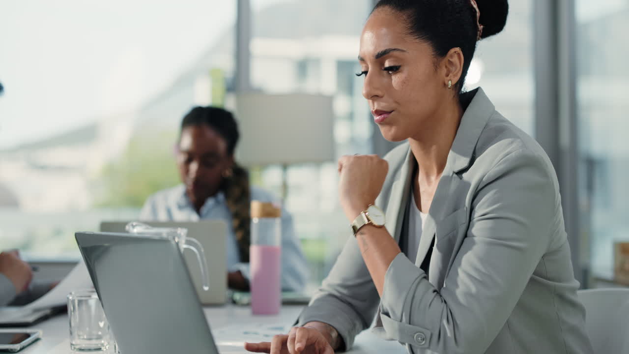 Businesswoman working on laptop in office