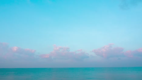 abstract colorful landscape background. panoramic view of abstract colorful cumulus fluffy clouds moving over ocean green water. sunlight reflect on the surface of sea. 4k nature background sea ocean