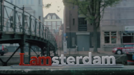 amsterdam slogan on city background