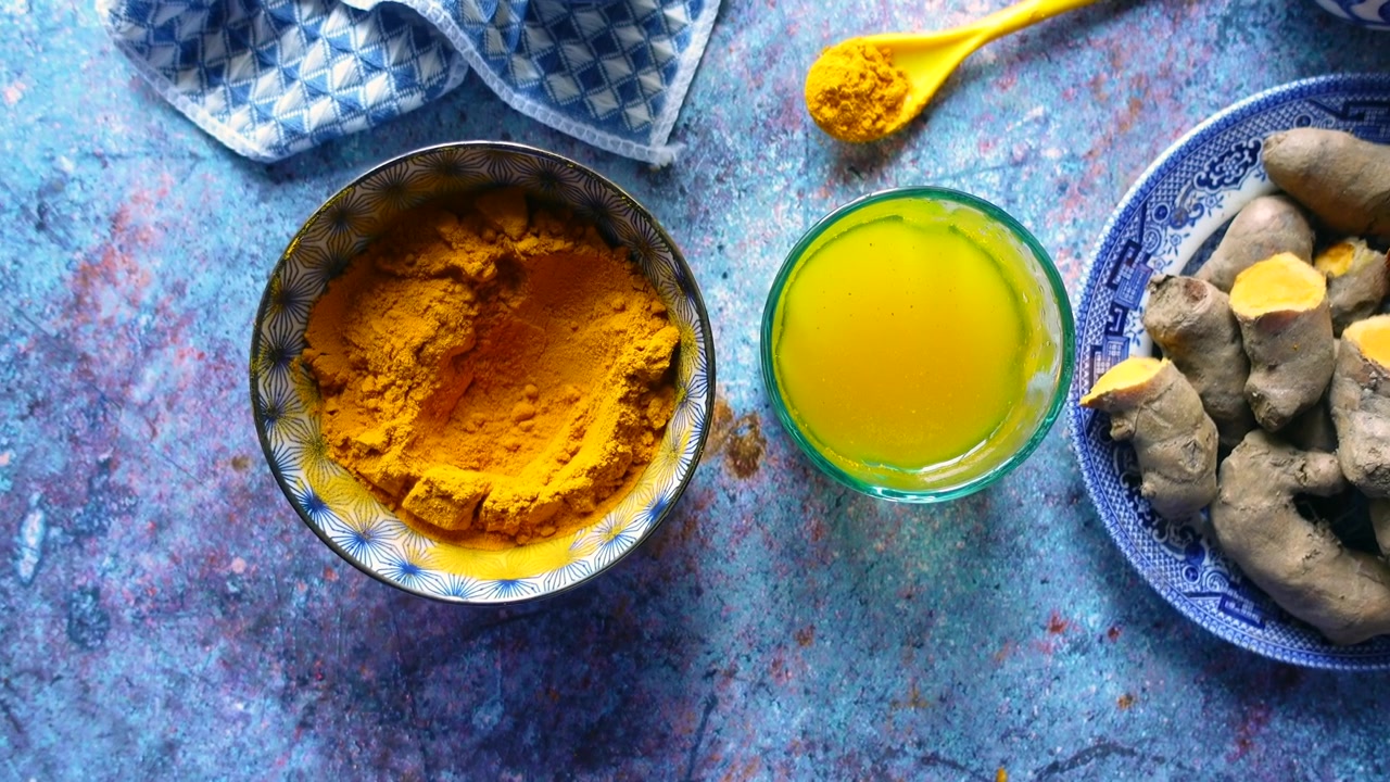 Fresh Turmeric Roots and Powder with Turmeric Juice