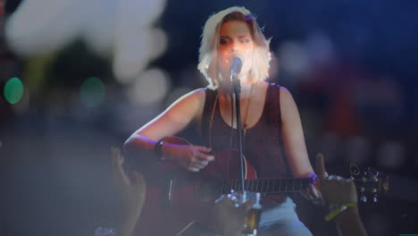 teenage musician performing on stage, integrating music theme with animated guitar and hand icons
