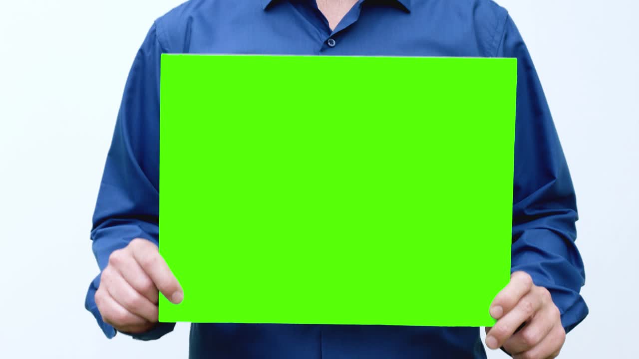 the man in his hands waving and shaking the green screen. Loop video
