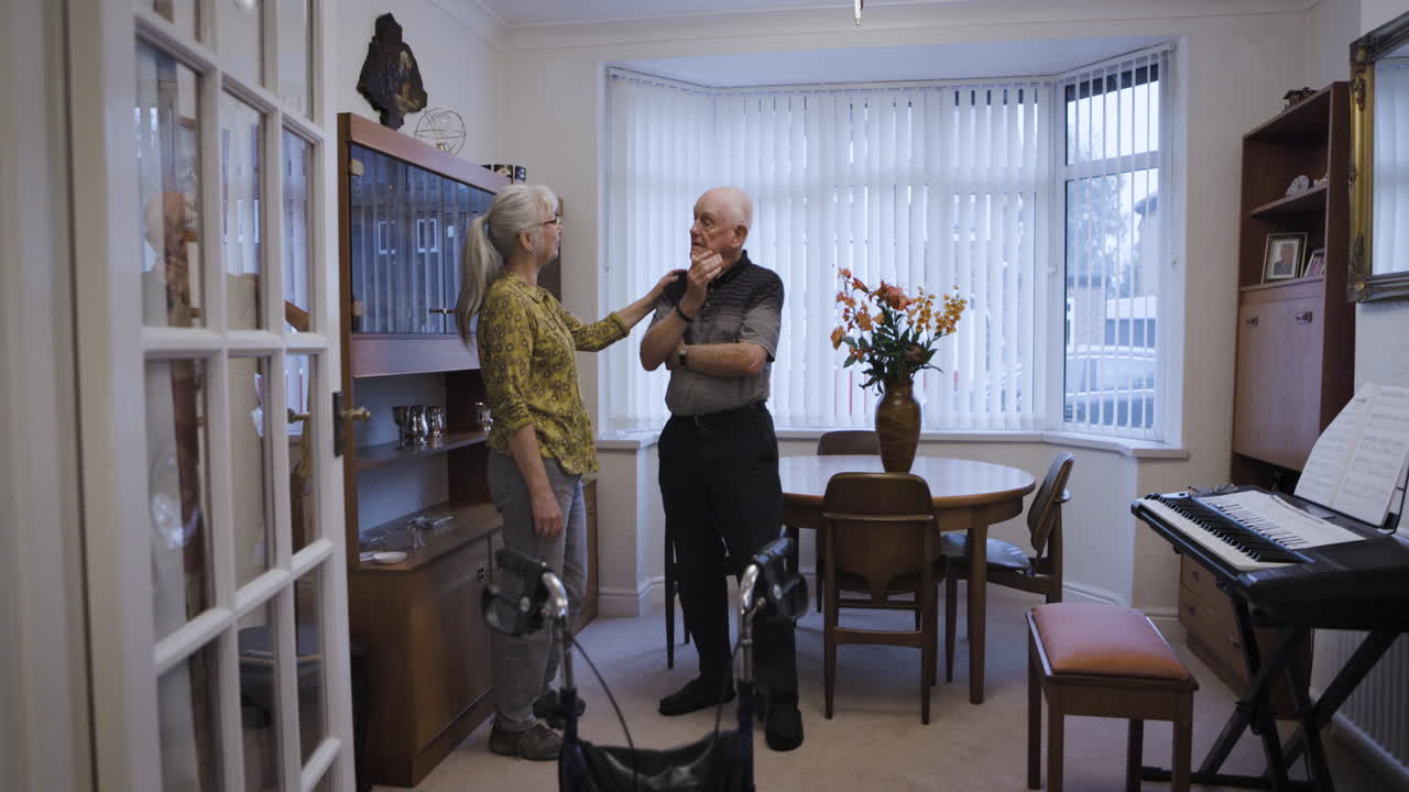 Elderly Couple Conversing in Living Room