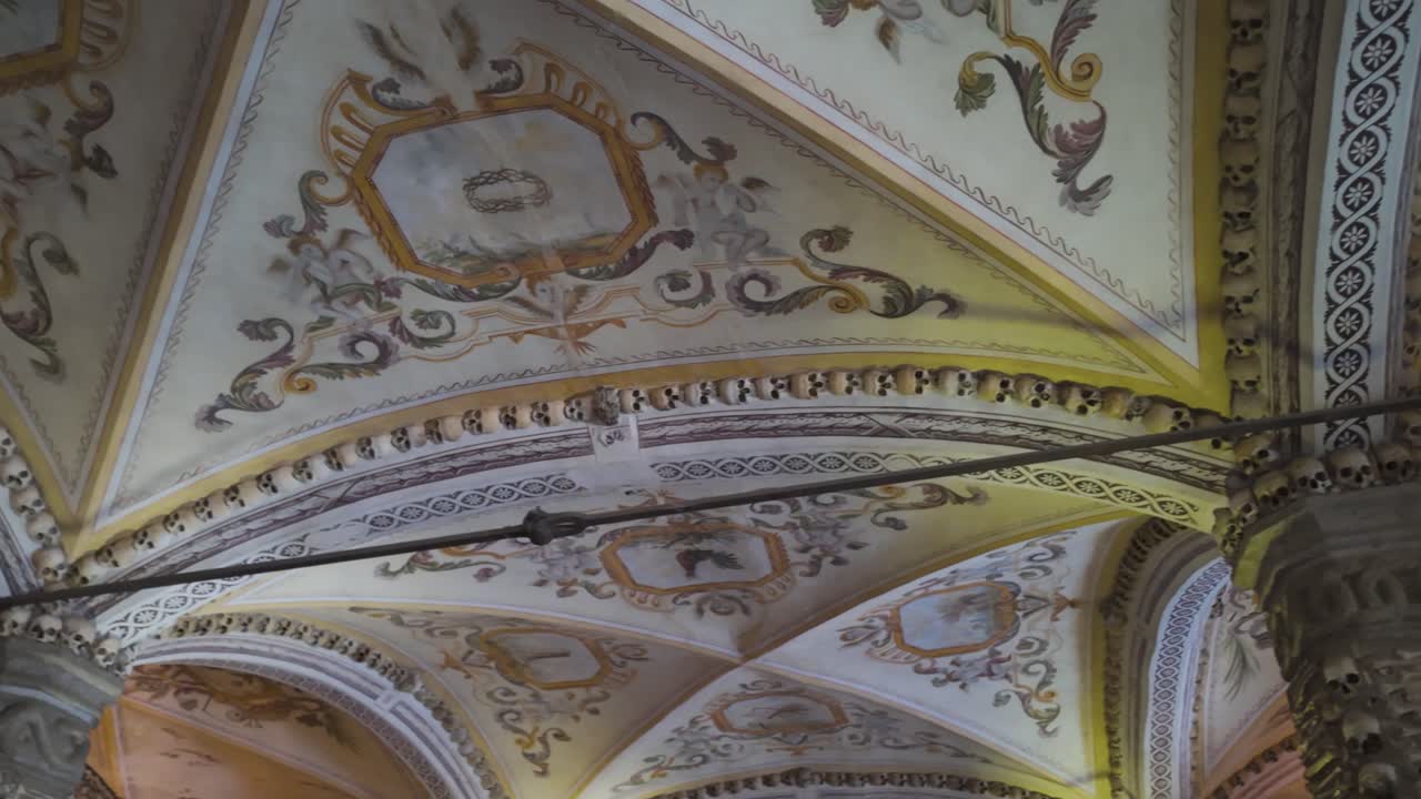 Baroque ceiling art with skulls in historic evora chapel of bones interior
