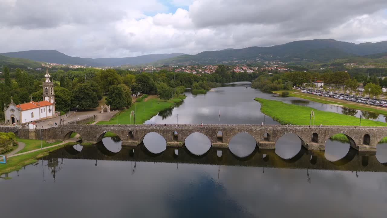 Roman Bridge with clouds in Ponte de Lima, reflecting serene elegance