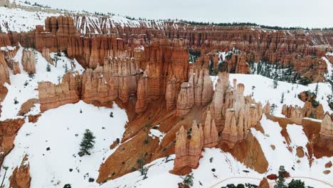 bryce national park, hoodoos with snow during winter in utah, usa - aerial drone shot