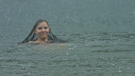 woman swimming in the summer rain