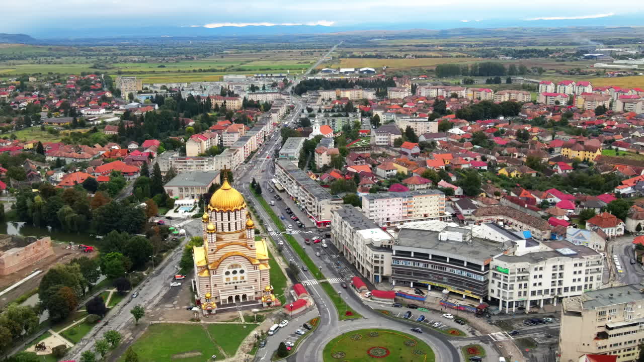 Aerial drone view of the Fagaras, Romania. Church of the Saint John the Baptist, multiple buildings, roads